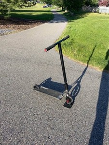 Envy Prodigy X Street gray with red pegs and bar ends