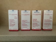 Clarins Minis x 4  Toning Lotion, Body Scrub, Cleansing Milk, Foaming Cleanser