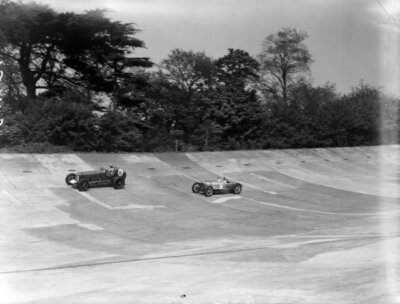 A Riley chases after another car 1937 Motor Racing Old Photo