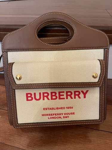 Buberry Mini Canvas and Leather Pocket Bag/$1,350 + Tax - Picture 6 of 12