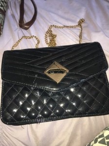 black leather crossbody bolsa with gold hardware