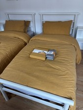 Two Single Argos Home Avalon White Metal BedFrames with mattresses, duvets etc.