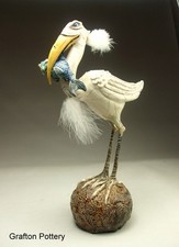 Bird with fish pottery sculpture by face jug folk art maker Mitchell Grafton
