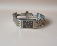 Citizen Men’s Eco Drive Stiletto Black Dial Gold and Silver Bracelet Watch