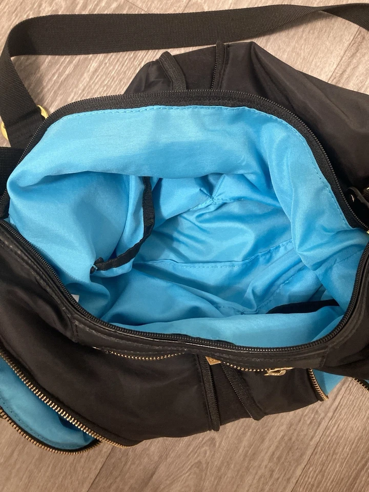 Bolsa de pañales para bebé Skip Hop bolsa de mensajero almohadilla cambiadora unisex negra de nailon lavable Foto 2 de 4