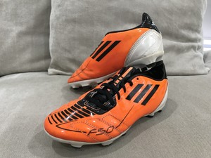 orange footy boots
