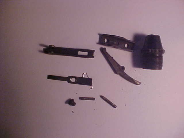Mossberg rifle parts model ? plug ,pins and misc parts