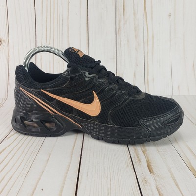 black and rose gold nike trainers