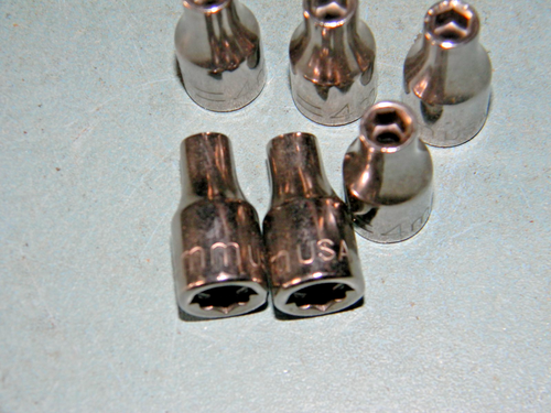 Set of six 4mm socket 6 pt, made in USA, with brown metal tips and engraved branding on a light gray surface.