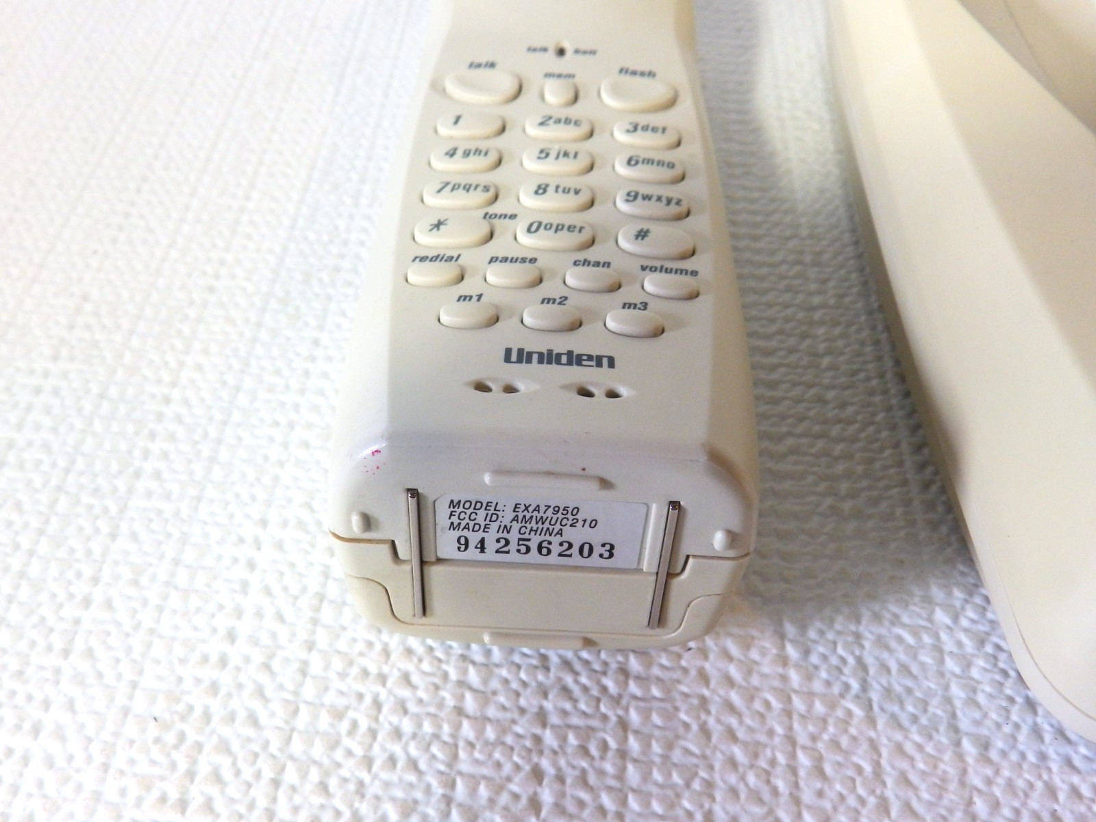 Vintage Uniden 900 MHz cordless phone with a digital answering system.