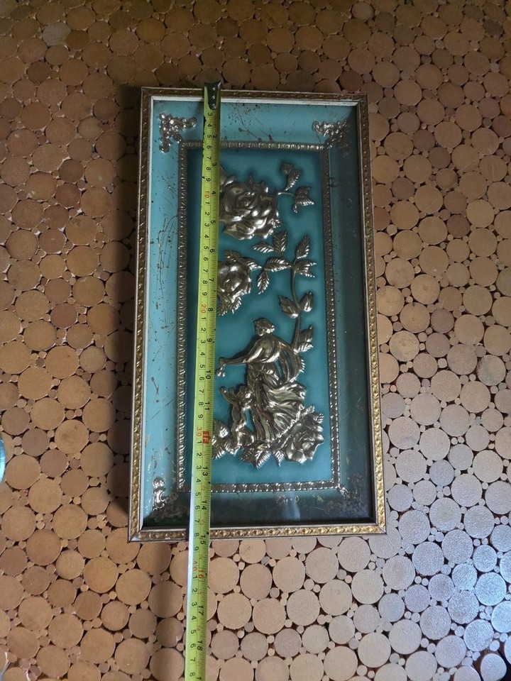 Genuine Metalcraft Four Seasons 3D relief wall art — the kind of textured, dimensional mid-century piece that stops guests in their tracks.