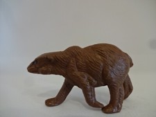 Stara figurka / identyfikator Hongkongu / niedźwiedź brunatny na bieżąco