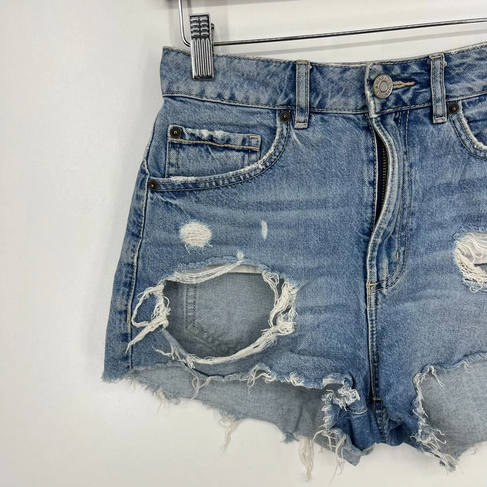 Pantalones cortos de mezclilla Garage para mujer talla 25 azul corte festival desgastado tiro alto Foto 2 de 4