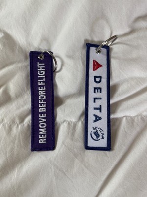 2 Delta ''Remove Before Flight'' bag tags - blue and purple