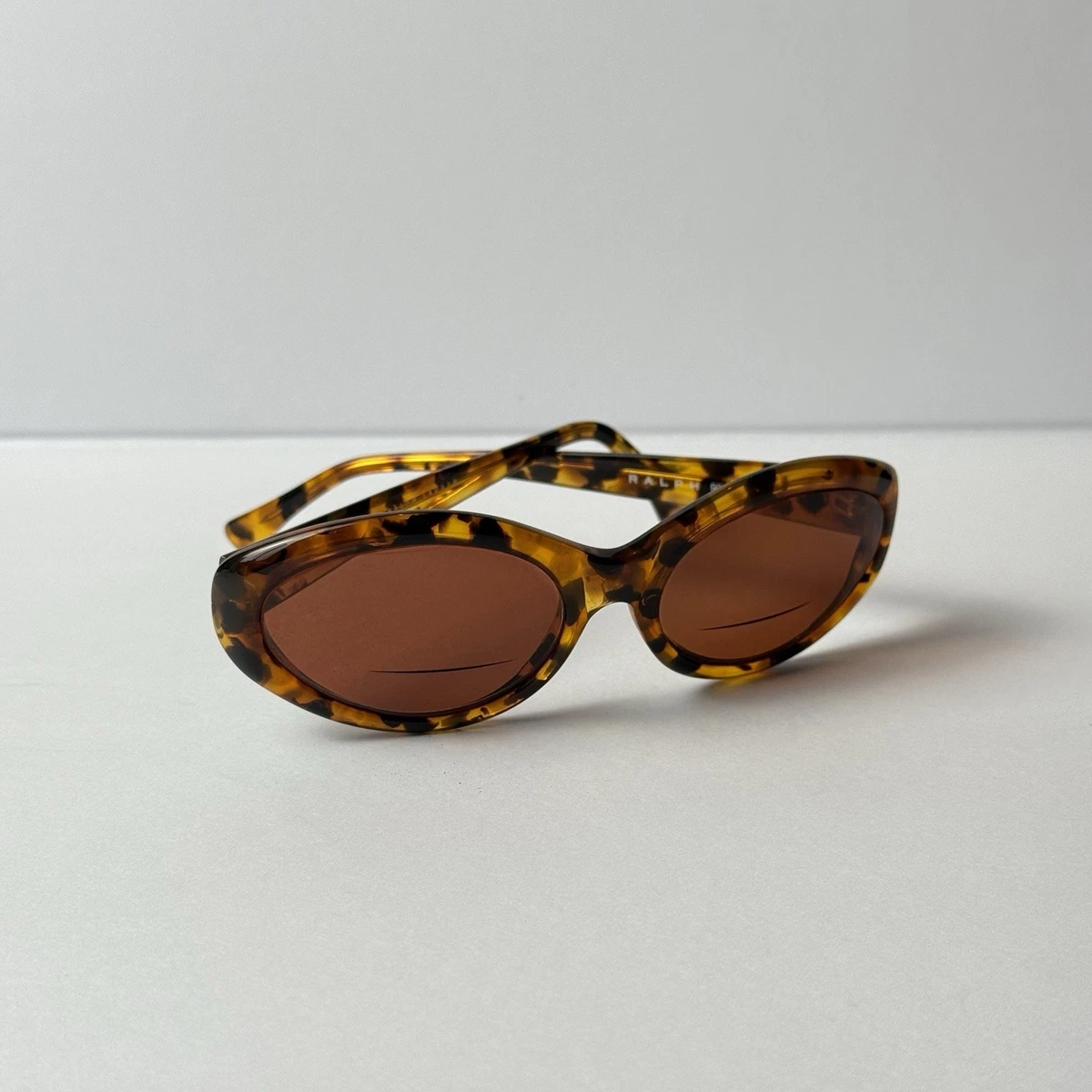 Preços baixos em Óculos de Sol Oval Quadro Ralph Lauren para
