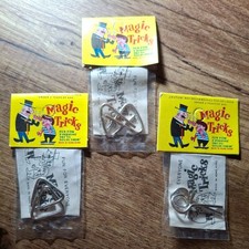 Vintage set of 3 of magic tricks puzzles. unopened in great condition.