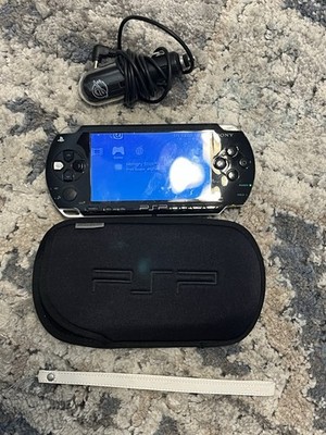 PSP With 512mb Sd Card, Soft case And Strap That Came With Original Car Charger