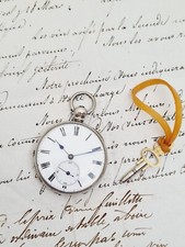 silver open face pocket watch working .