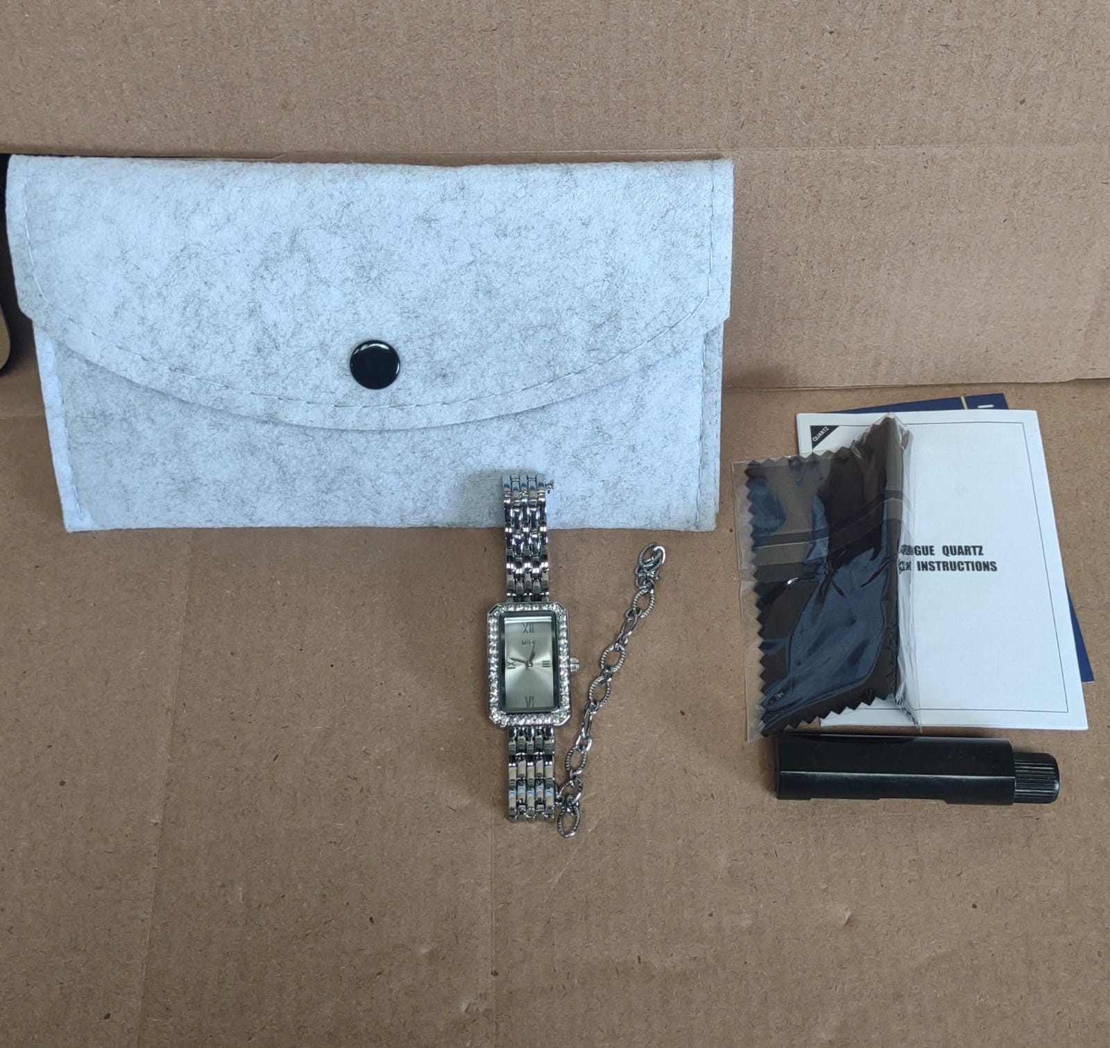 Midi, silver coloured with rectangular face, link watch with pouch