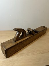 23 Inch antique wooden woodworking plane, classified as a jointer or try plane.