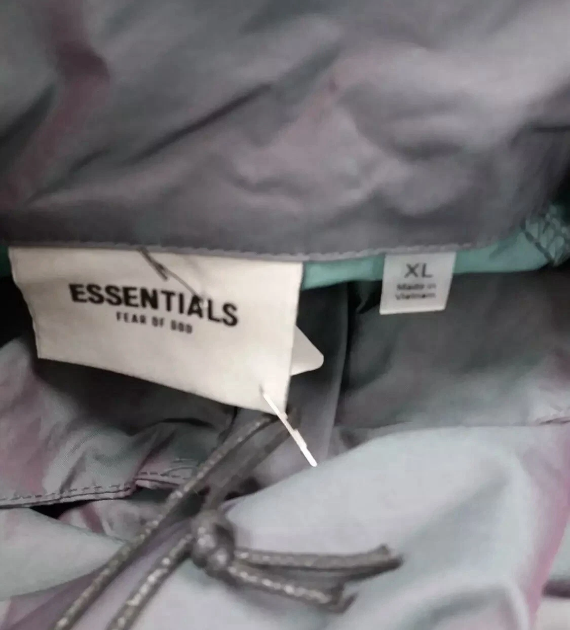 FEAR OF GOD Giacca impermeabile uomo ESSENTIALS PAURA DI DIO UK XL impermeabile metallizzato impermeabile nuovo con etichette