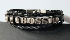 PULSERA HUGO BOSS Mod. 1 CUERO TRENZADO, METAL, CUENTAS RETRO. Cierre seguro.