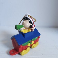 Whitman Peanuts Lucy with Green Megaphone on Red Train Christmas Ornament 2006