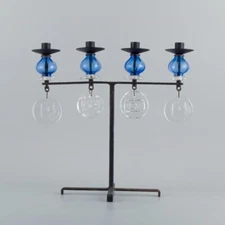 Erik Höglund for Kosta Boda. Large candle holder in cast iron with art glass.