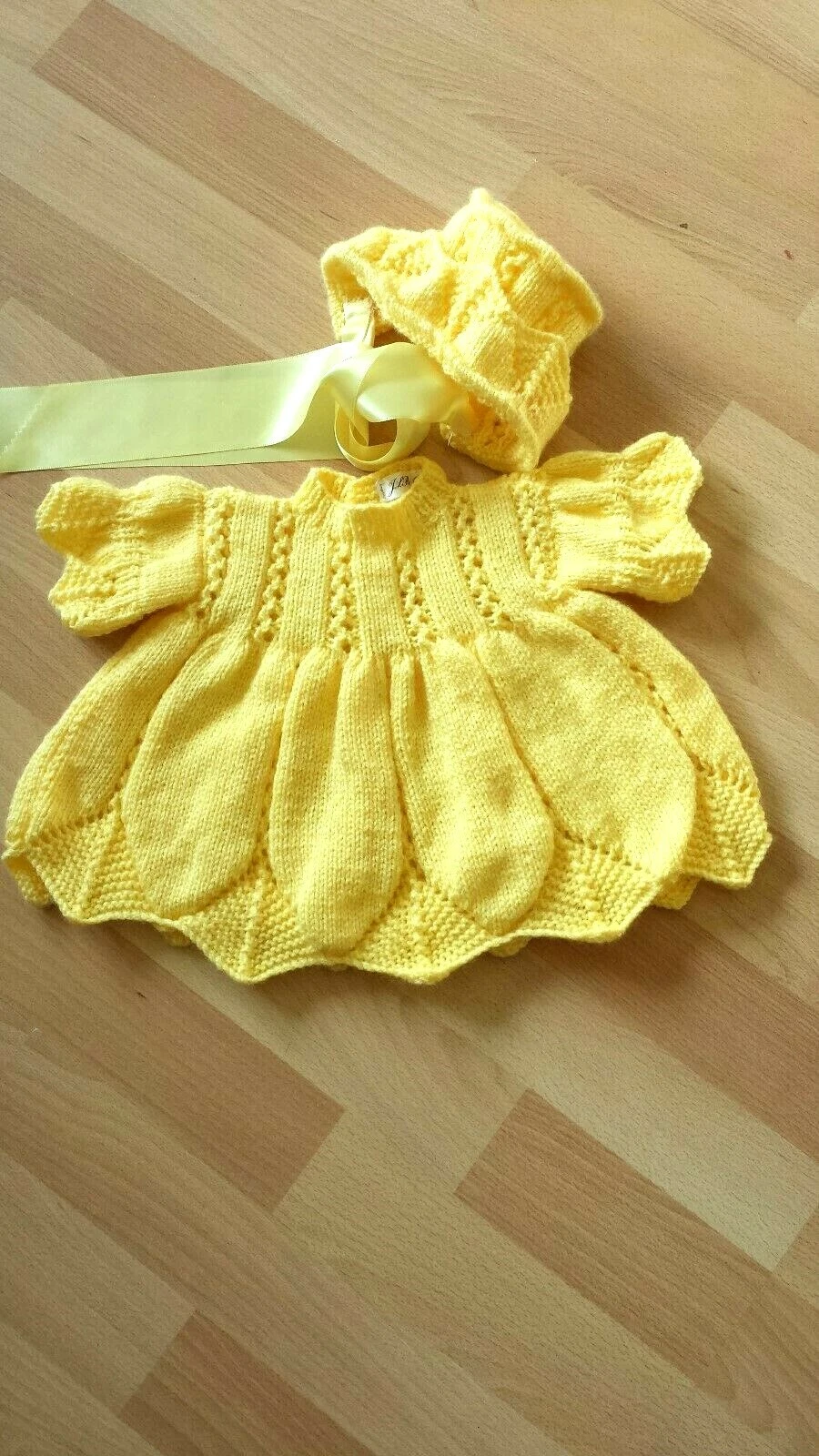 handknit baby dress and hat. first size newborn or reborn doll yellow
