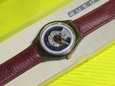 1. Serie "SENZA apertura bilanciere" AUTOMATICO Swatch RUBINO - SAM100 - NUOVO & IMBALLO ORIGINALE