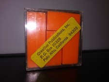 Creative Publications Puzzle in a Box Educational Orange Level IQ Game Shape Fit
