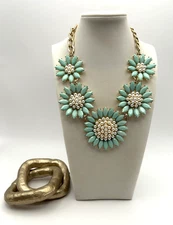 Charming Charlie's mint green and pearl flower statement necklace.