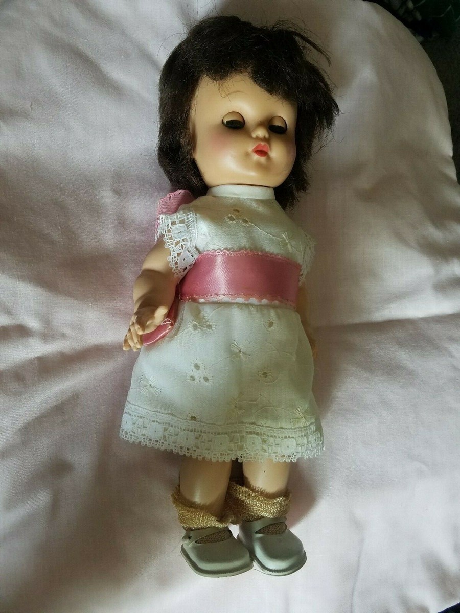 sleepy brown dress up EEGEE doll hair and green eyes. White dress, socks and shoes Mix Match Mix Match VENDOR COLOR-RUM RAISIN Choose your size:57