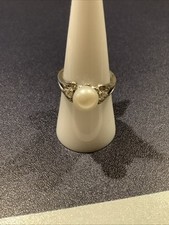 Sterling Silver Ring with Synthetic Pearl Center and Cubic Zirconia Accents Si
