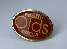 Vintage 80s Olds Really Cares Oldsmobile Pin GM General Motors Red Gold Tone
