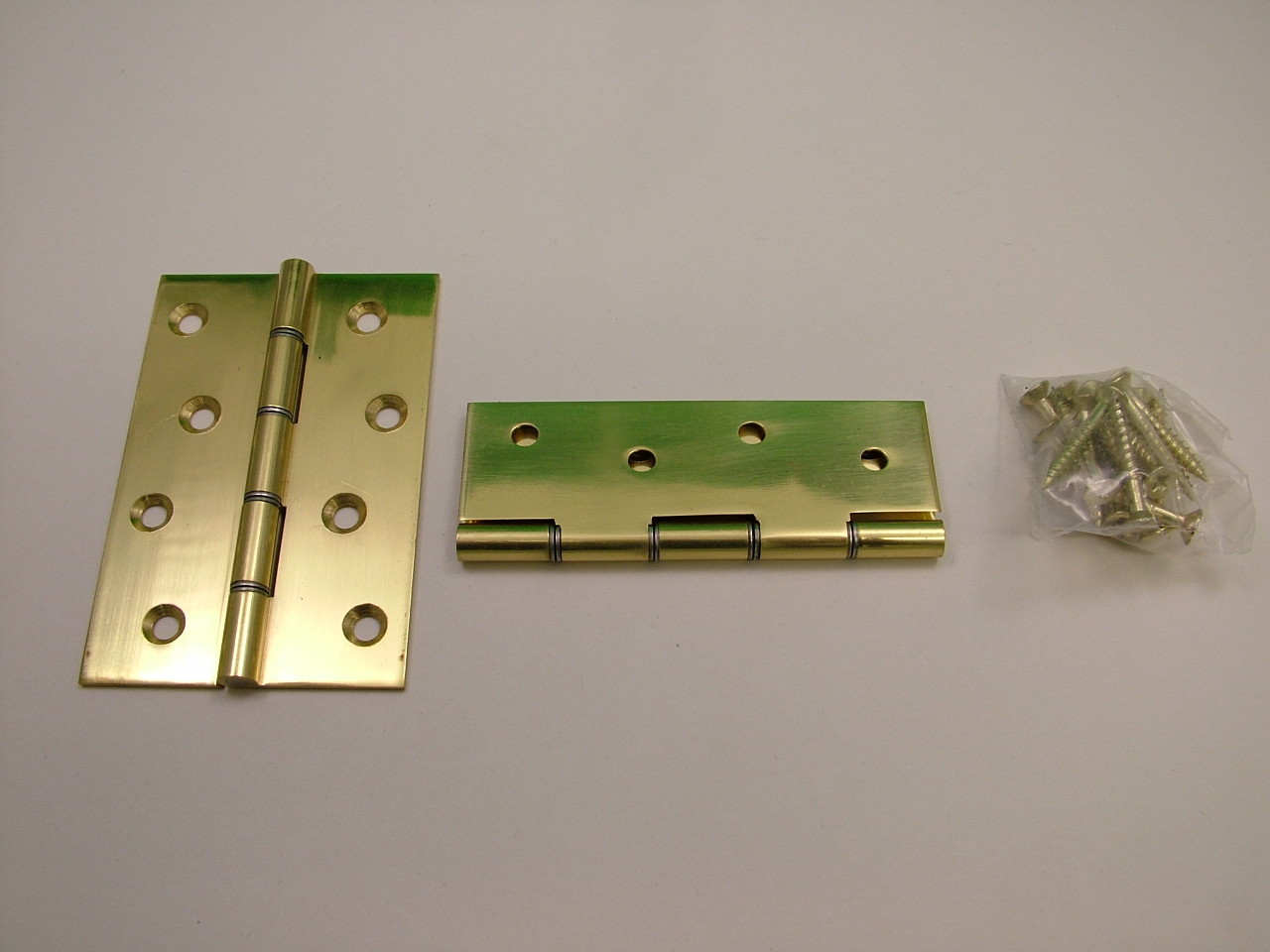 Pair of polished solid brass hinges complete with screws 100mm/ 4"" door hinge