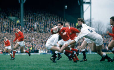 David Evans of Wales goes past Wade Dooley of England during thei - Old Photo