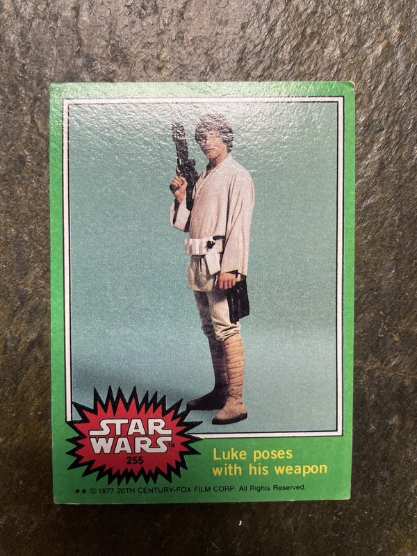 1977 Star Wars Series 4 Green Trading Card  #255 Luke Poses With His Weapon 