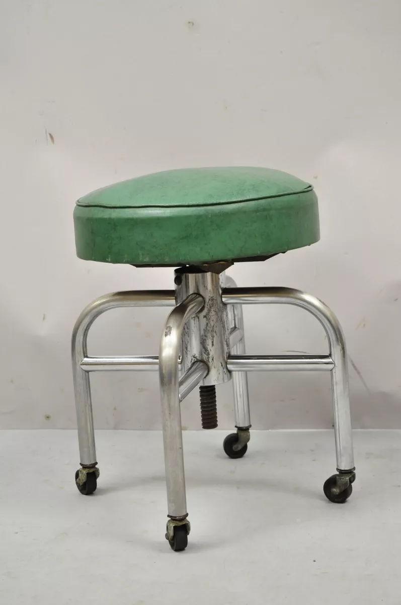 fully adjustable early 1920's american vintage industrial four-legged  factory workbench stool with pre-drilled hole extensions