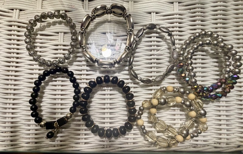 Lot of 9 Vintage beaded stretchy bracelets. Two sets, 5 singles.