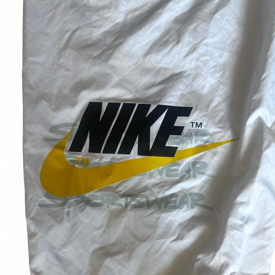 Pantalones deportivos ligeros vintage XL Nike años 90 amarillos Wind para niños  Foto 2 de 4