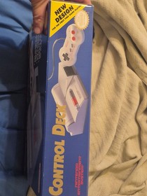 Classic NES game console. 2 controllers and NES advantage in box with packaging