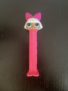 lol doll with white hair and pink bow