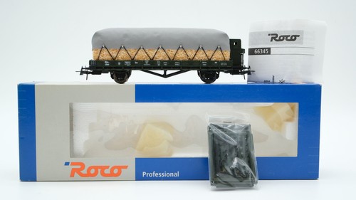 Roco H0 66345 Niederbordwagen mit Bremserhaus und Ladung (Stroh unter Plane) K.B | Zustand: Gebraucht