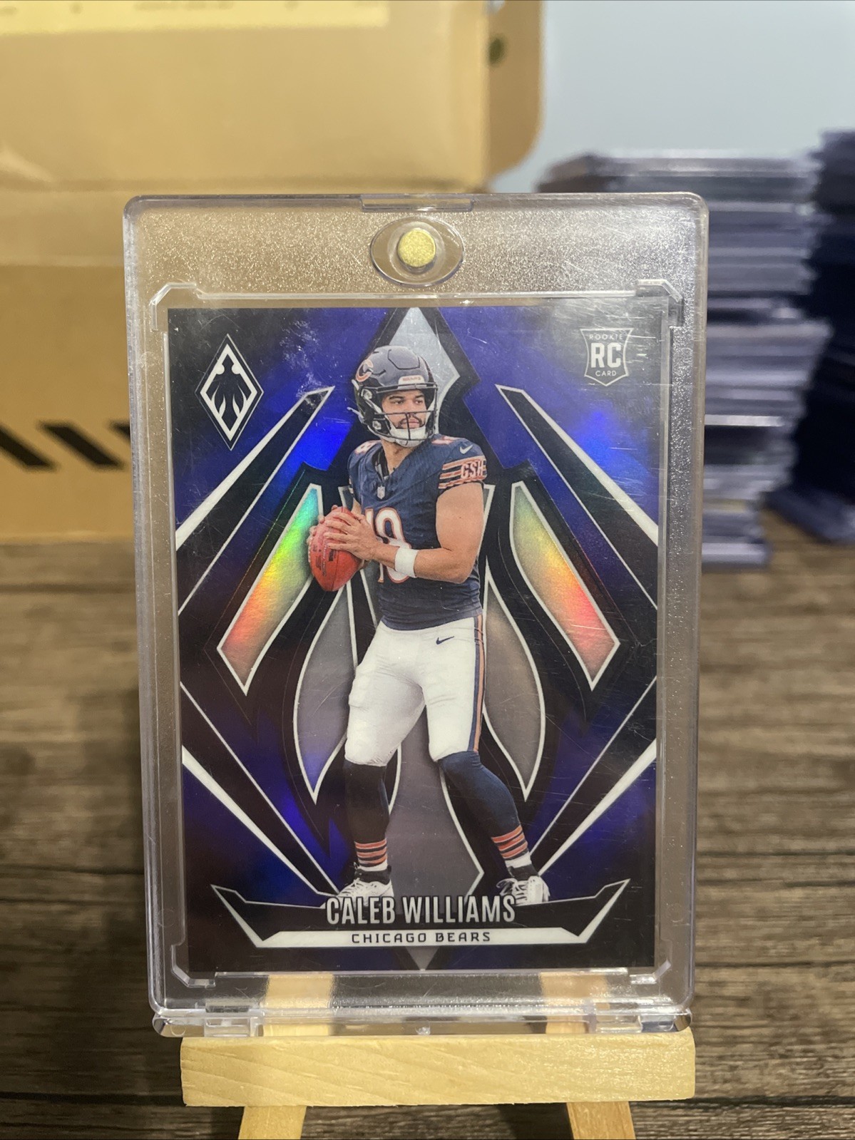 2024 Panini Phoenix - Rookies Caleb Williams #151 Blue Fade /249 (RC)