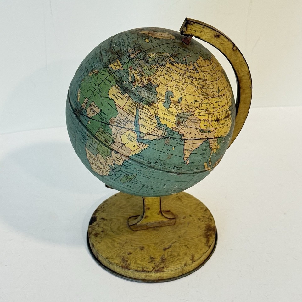 A tiny 1930s–40s J. Chein & Co. tin lithograph rotating globe — a charming, pre-war geographical artifact that looks incredible on a shelf or desk.