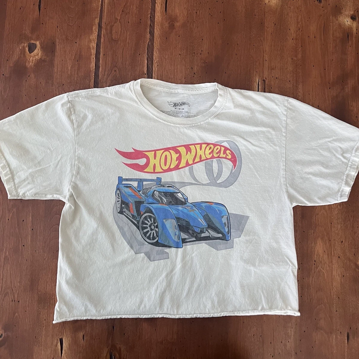 White shirt with blue car sales