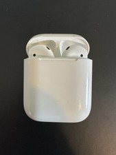 Apple AirPods 1st Generation (Model A1523) with original Apple charging case.
