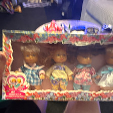 Boxed Set of 4 Blonde Baby Girl Dolls w/ Outfits, Blue Eyes, Light Skin