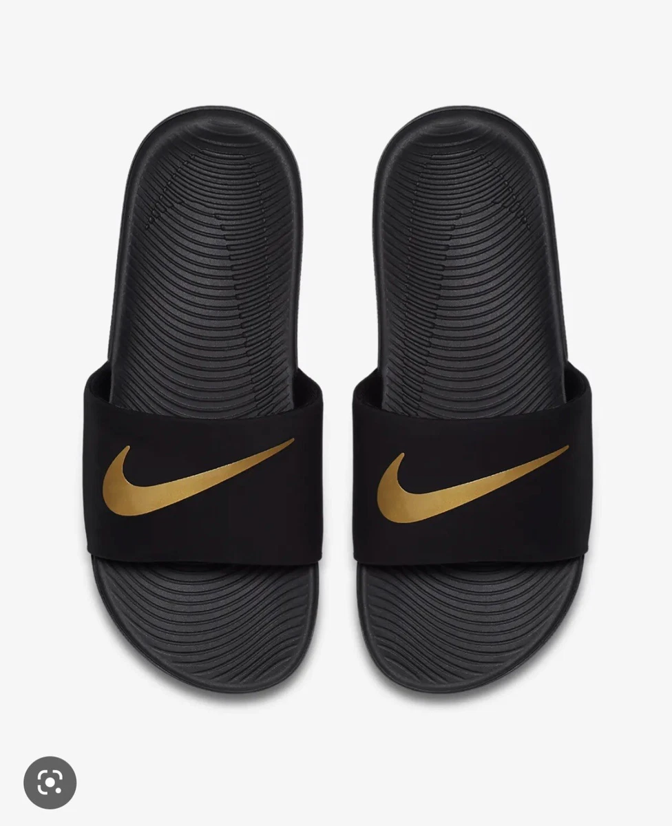 gold and black nike sandals